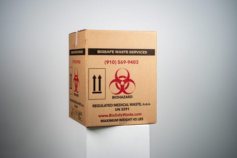 BioSafe Waste Services regulated medical waste box marked with the biohazard symbol