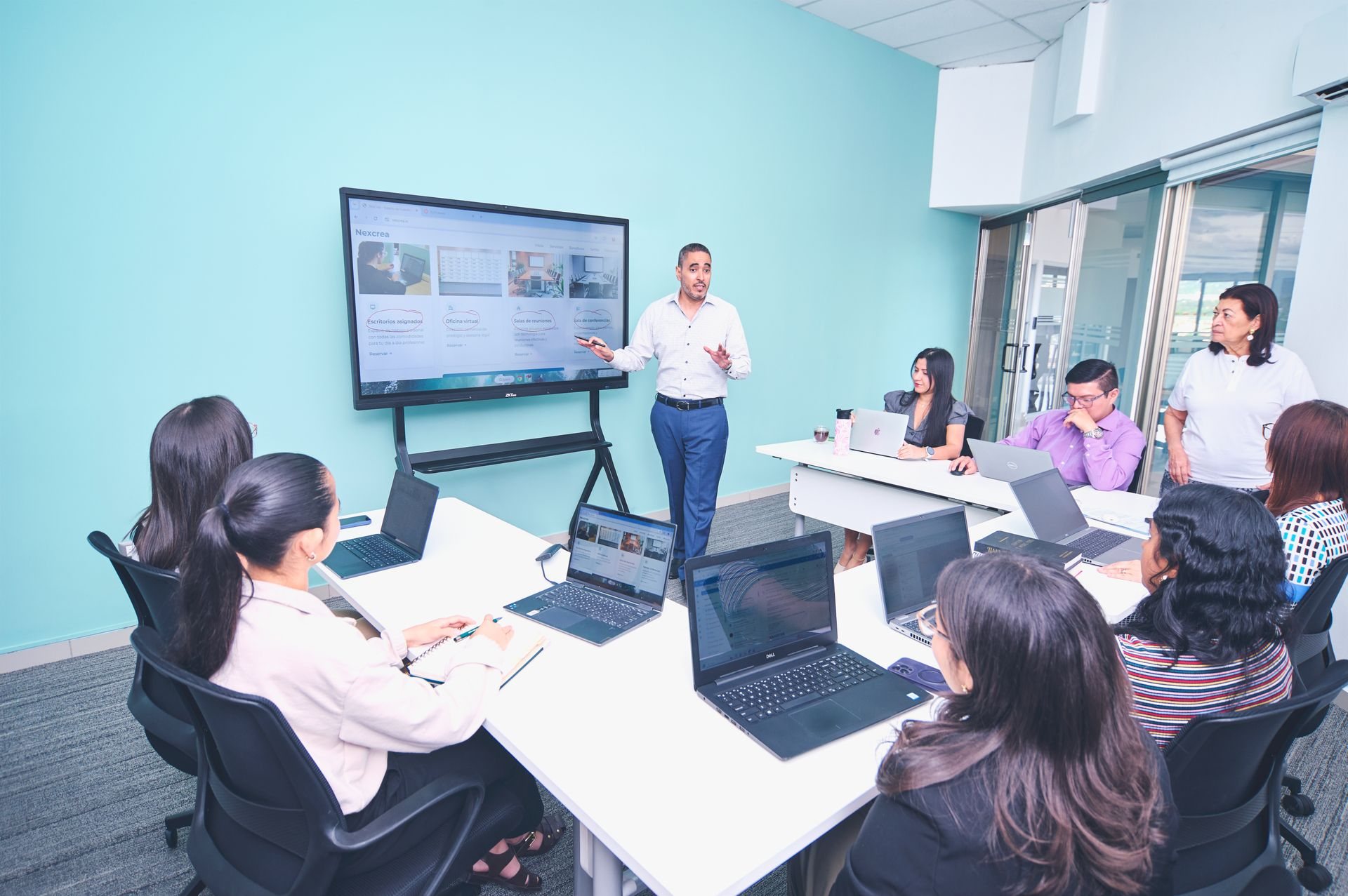 Team attending a training presentation in a modern meeting room