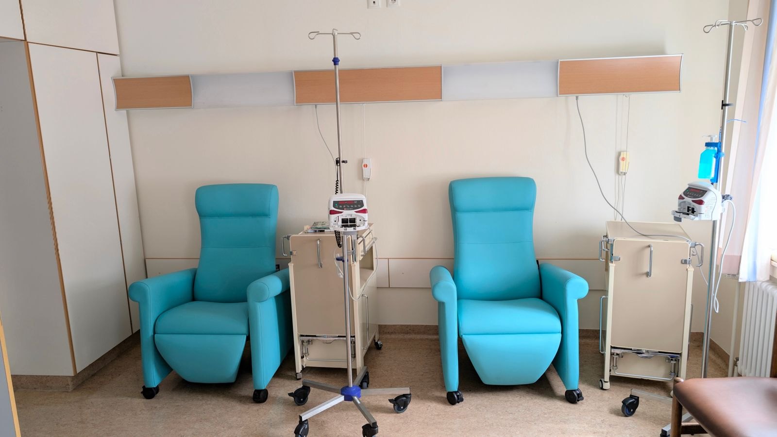 Infusion suite chairs and IV stand in an oncology treatment room